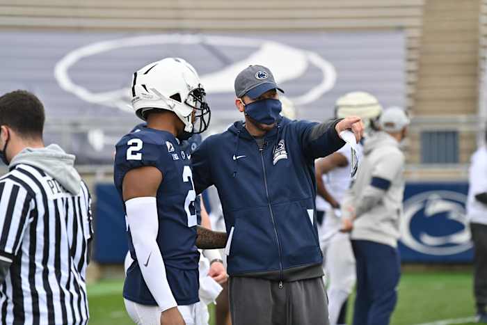 Penn State offensive coordinator Mike Yurcich with quarterback Ta'Quan Roberson during spring drills. (Courtesy Penn State Athletics)